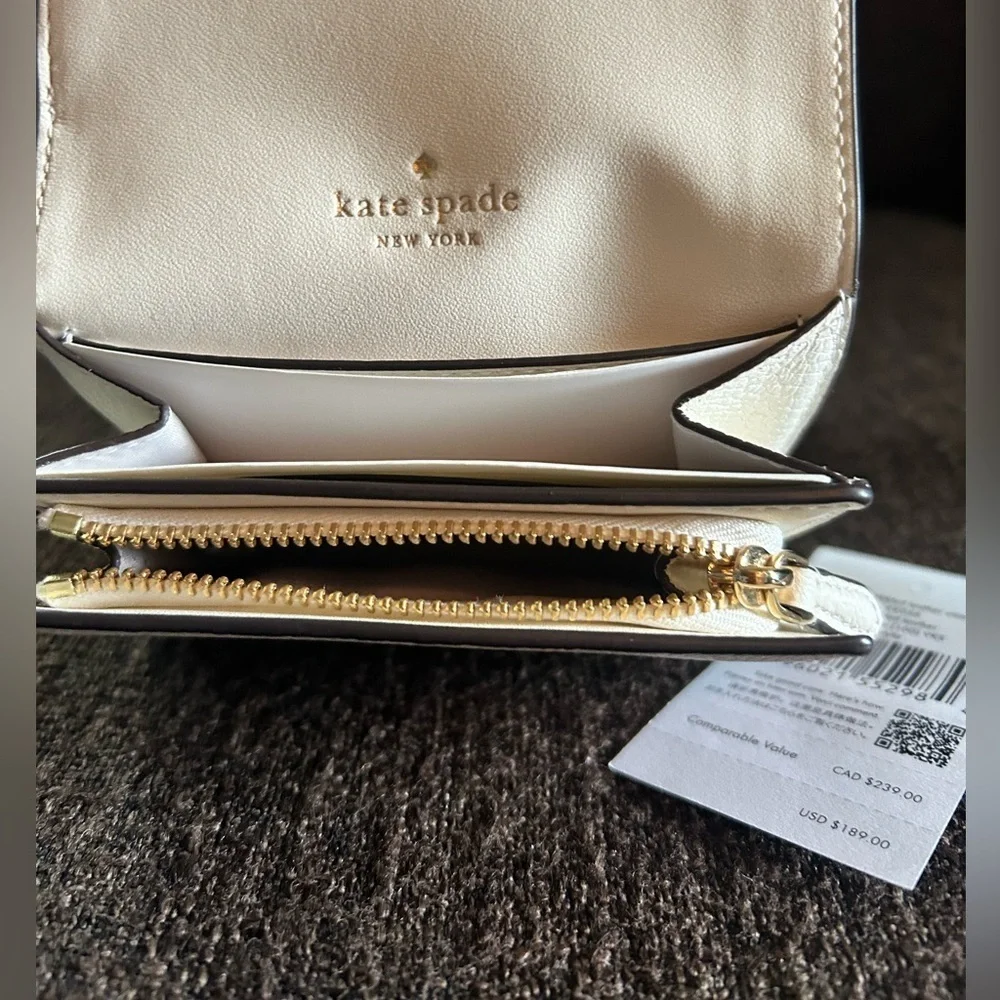 NWT- Kate Spade L- Zip White wallet. In wrapper.